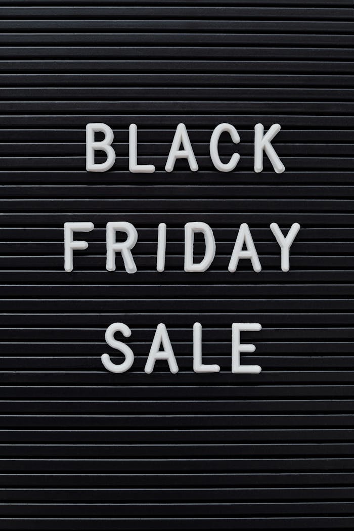 Simple black sign with 'Black Friday Sale' text, perfect for consumerism and discount themes.